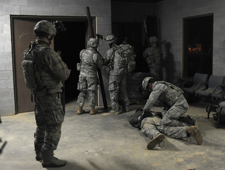 U.S. Army soldiers with the Headquarters and Headquarters Company, 3rd Brigade Special Troops Battalion, 3rd Brigade Combat Team, 82nd Airborne Division and U.S. Air Force Airmen from the 824th Base Defense Group work together in collecting and setting up a detainee control point during Joint Operations Access Exercise 12-01 in Fort Bragg, N.C., Feb. 12. U.S. Army and U.S. Air Force members jumped together and provided security along with helping evacuating American citizens out of that hostile environment once the reached there main objective. (U.S. Air Force photo by Staff Sgt. Stephanie Mancha/Released)