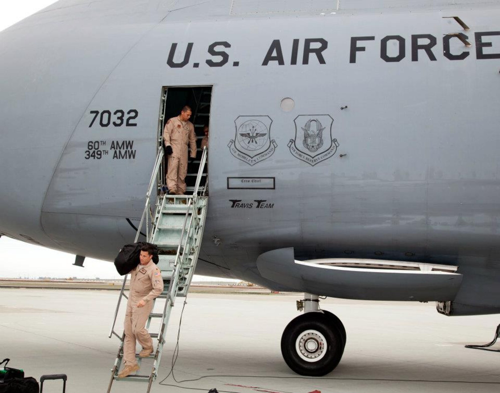 TRAVIS AIR FORCE BASE, Calif. -- C-5 Galaxy aircrew from the 312th Airlift Squadron and 22th Airlift Squadron return to Travis Air Force Base, Calif., Feb. 12, 2012, after supporting Operation Enduring Freedom. The C-5 Galaxy is the largest aircraft in the U.S. Air Force fleet, optimized for moving large and heavy cargo. The reserve and active-duty troops from the 349th and 60th Air Mobility Wings were met by their friends and family at the base in the San Francisco Bay Area. (U.S. Air Force photo / Lt. Col Robert Couse-Baker) 