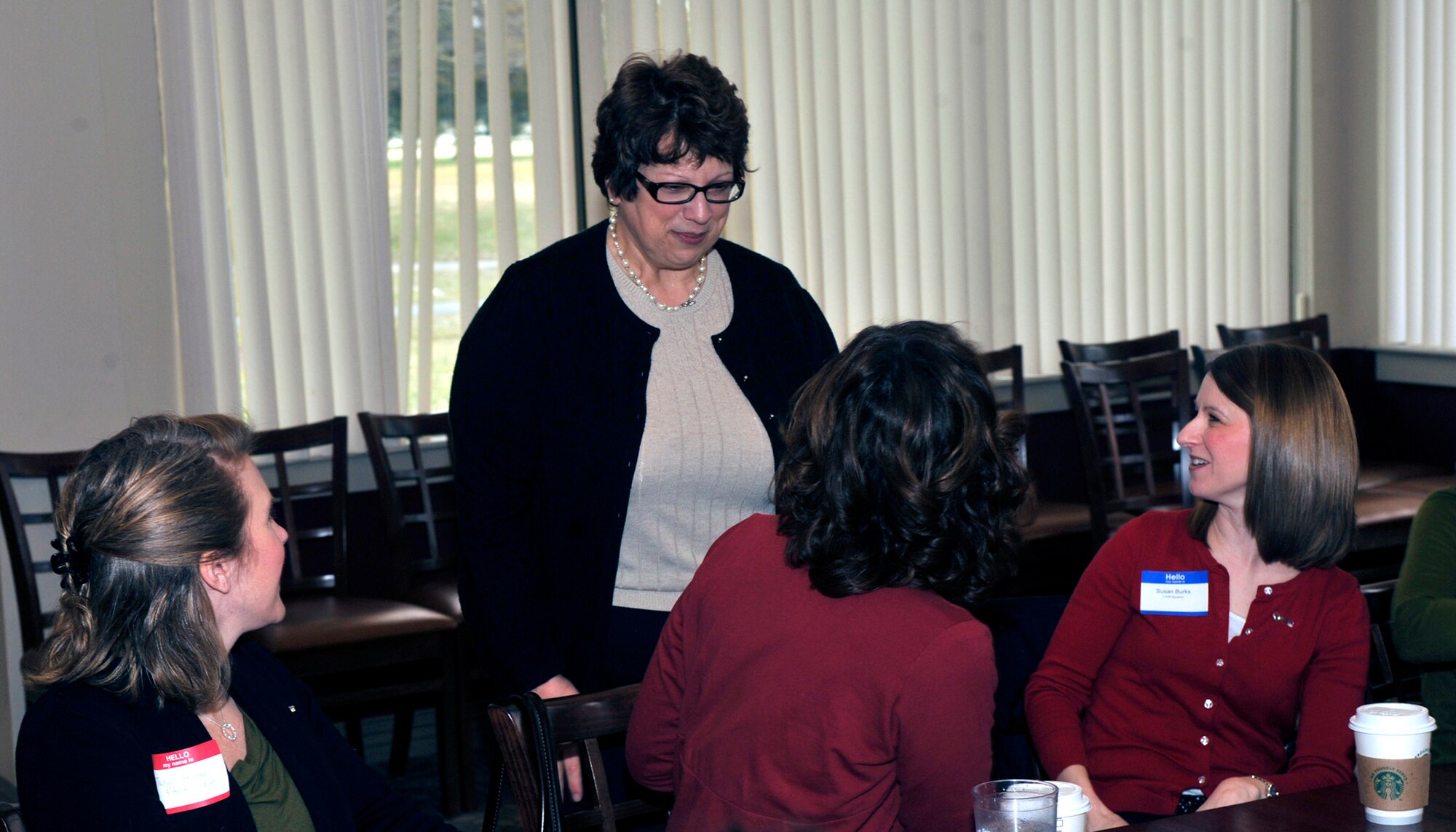 Patricia Ramsay, spouse of 18th Air Force commander Lt. Gen. Mark Ramsay, speaks with members of the Key Spouse Program Feb. 14, 2012, at the Eagle Creek Golf Course, Dover Air Force Base, Del. The Key Spouse Program is a select group of spouses who ensure family members of deployed Airmen have their needs met. (U.S. Air Force photo by Tech. Sgt. Chuck Walker)