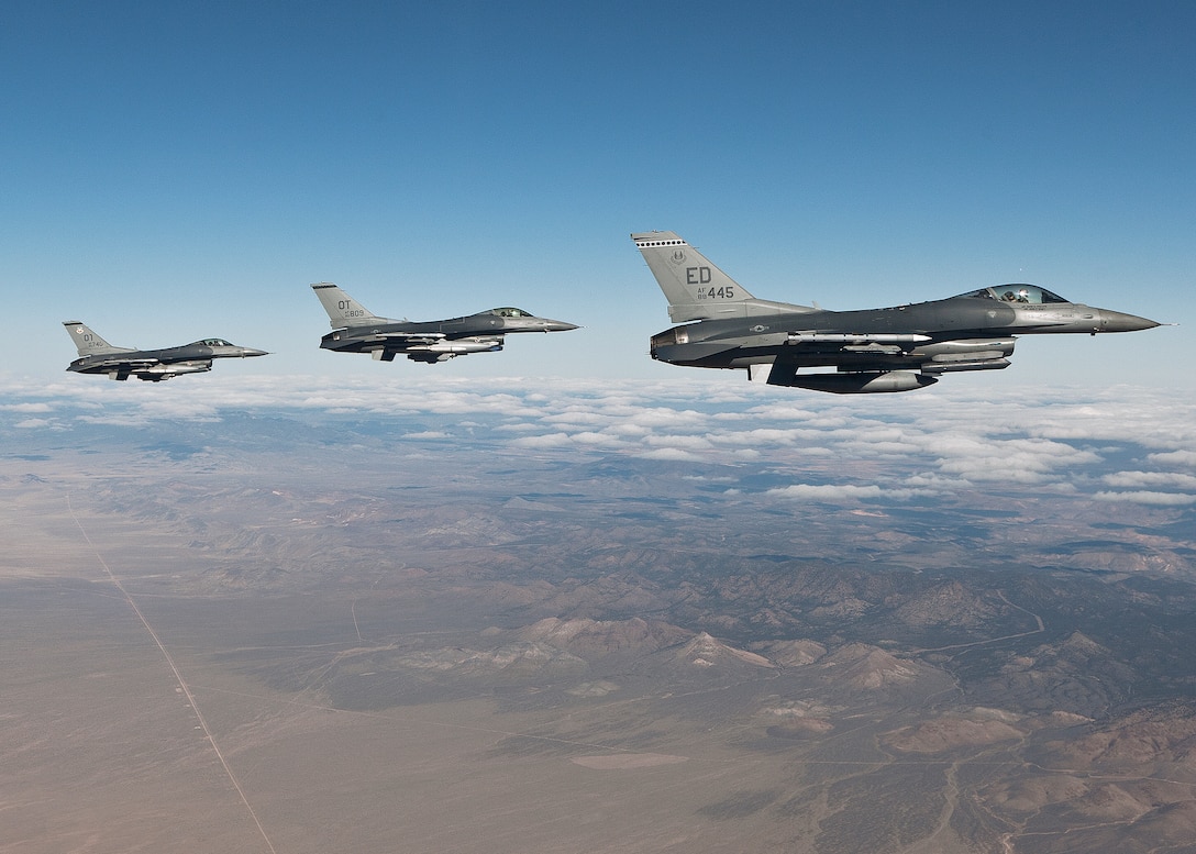 Maj. Brian Deas, 416th Flight Test Squadron test pilot, and two pilots from the 422nd Test and Evaluation Squadron at Nellis Air Force Base, Nev. fly a formation flight back to Nellis AFB after completing their Red Flag mission Feb. 3. (Lockheed Martin photo by Chad Bellay)