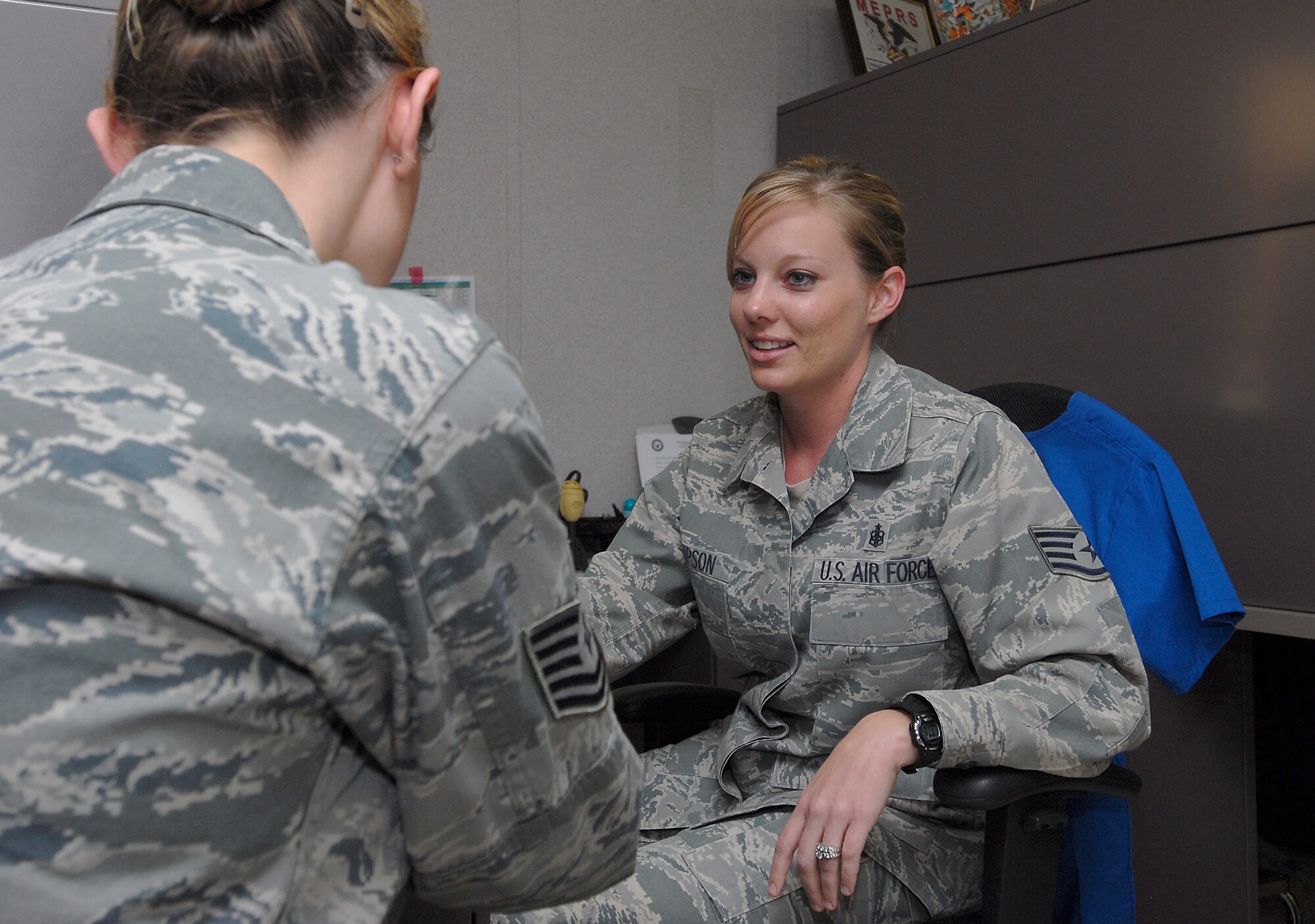 GOODFELLOW AIR FORCE BASE, Texas—Staff Sgt. Stephanie Thompson, 17th Medical Support Squadron, consults a fellow Airman Feb. 10 here. Thompson is the recipient of the Air Force level Outstanding Health Plan Management NCO of the year award. (U.S. Air Force photo/Airman 1st Class Michael Smith)