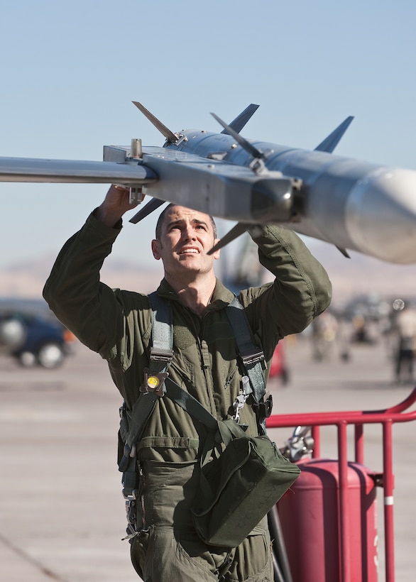 Maj. Brian Deas, 416th Flight Test Squadron F-16 test pilot, preflights his jet before joining the day-time war exercise during Red Flag Feb. 1. (Lockheed Martin photo by Chad Bellay)