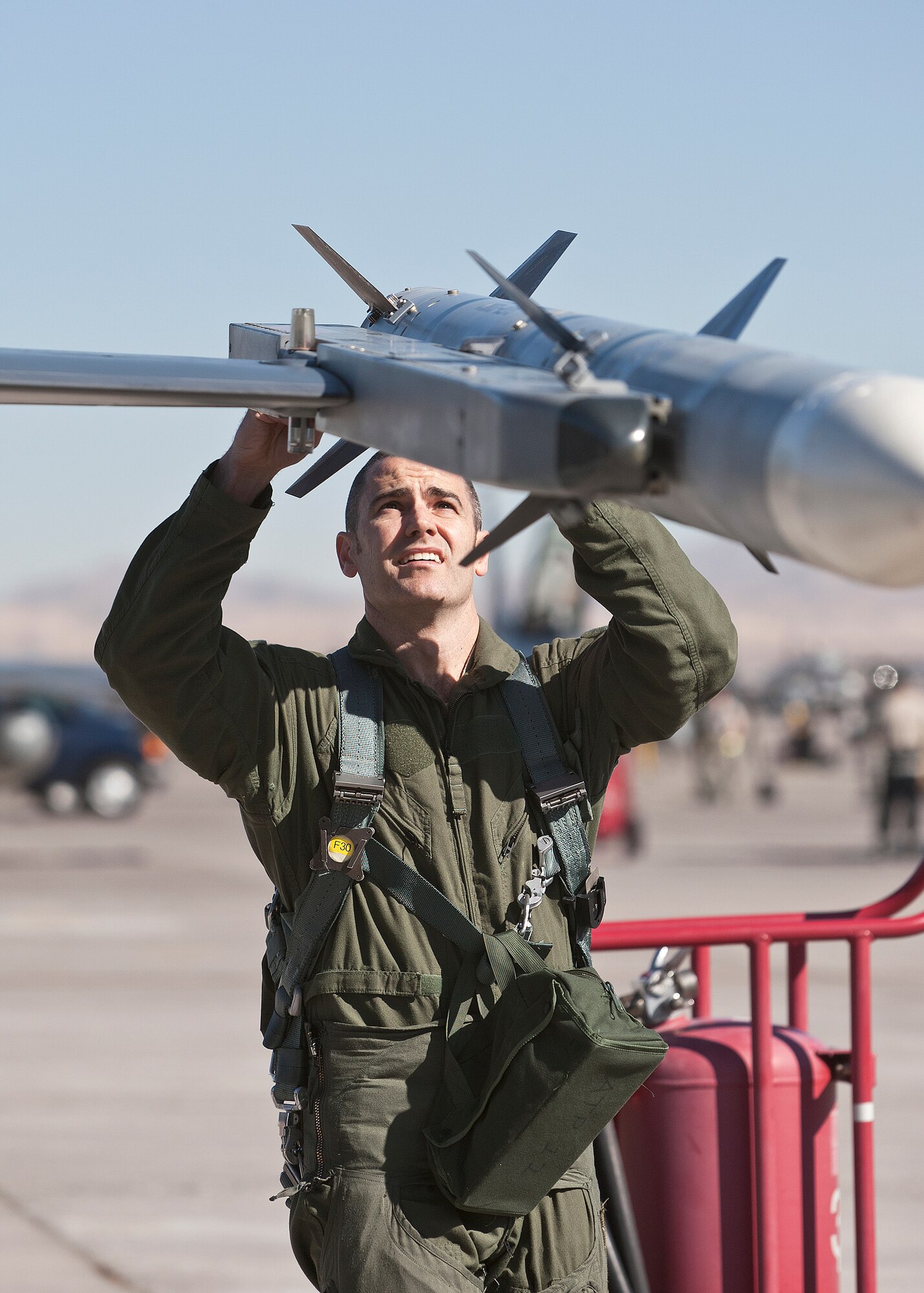Maj. Brian Deas, 416th Flight Test Squadron F-16 test pilot, preflights his jet before joining the day-time war exercise during Red Flag Feb. 1. (Lockheed Martin photo by Chad Bellay)