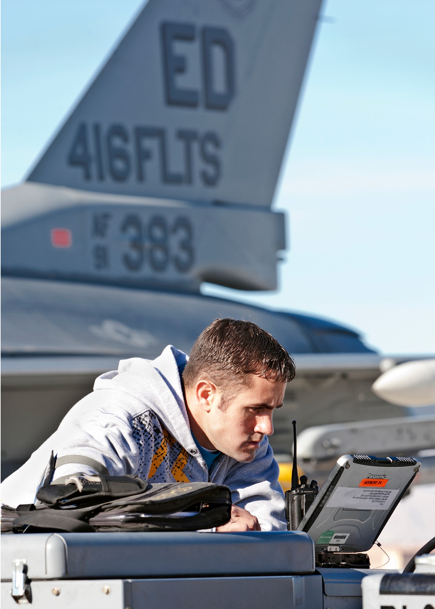 Clinton Minor, 416th Flight Test Squadron maintainer, reads over some training orders before prepping an F-16 for a live weapons release during a Red Flag exercise Jan. 24 at Nellis Air Force Base, Nev. (Lockheed Martin photo by Chad Bellay)