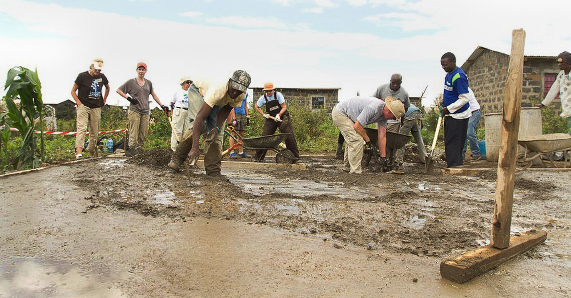Technical Sgt. Tracy Piel of the 25th Aerial Port Squadron recently traveled to Kenya to build houses with Habitat For Humanity’s Global Village. Here, volunteers prepare the foundation for one of four homes built for Kenyans displaced in the violence that erupted during the 2007 elections.
