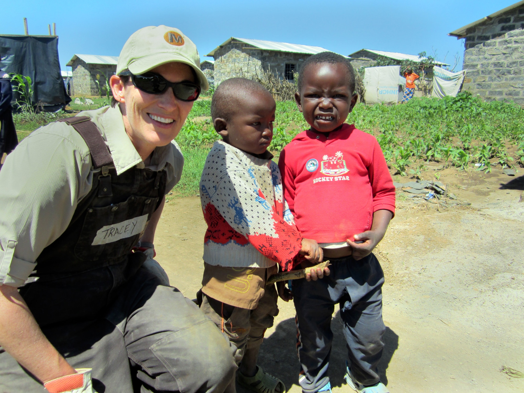 Technical Sgt. Tracy Piel of the 25th Aerial Port Squadron recently traveled to Kenya to build houses with Habitat For Humanity’s Global Village. Volunteers built four homesfor Kenyans displaced because of the violence that erupted during the 2007 elections. Here, Piel meets a couple of the local children.