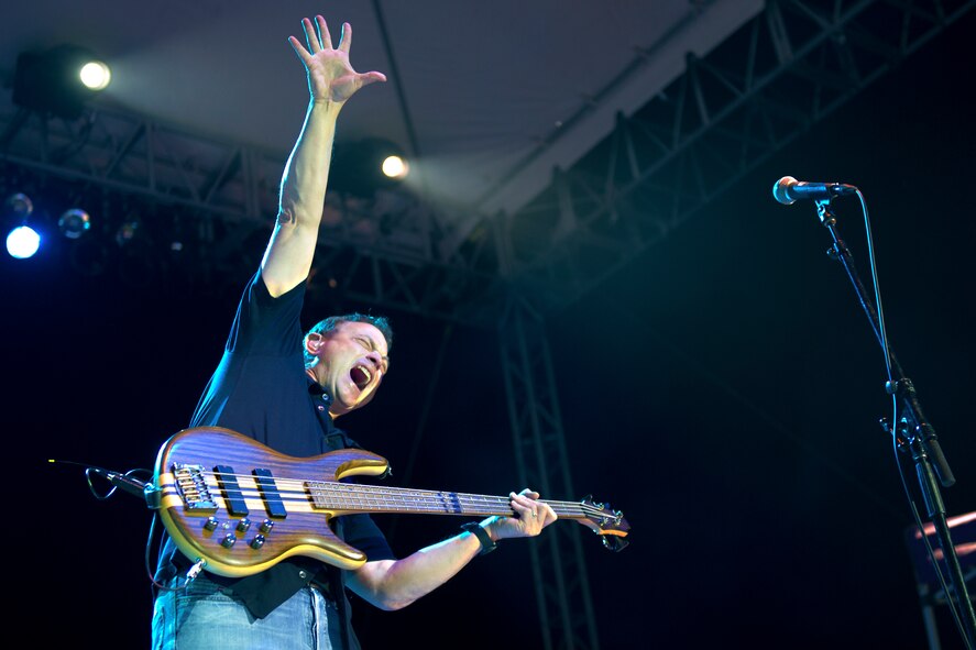 Gary Sinise, namesake and lead bass guitarist for the Lt. Dan Band, perform a concert for the troops Feb. 10 at Joint Base Pearl Harbor-Hickam, Hawaii. Some have described Sinise as the Bob Hope of this generation. (U.S. Air Force photo by Staff Sgt. Mike Meares)