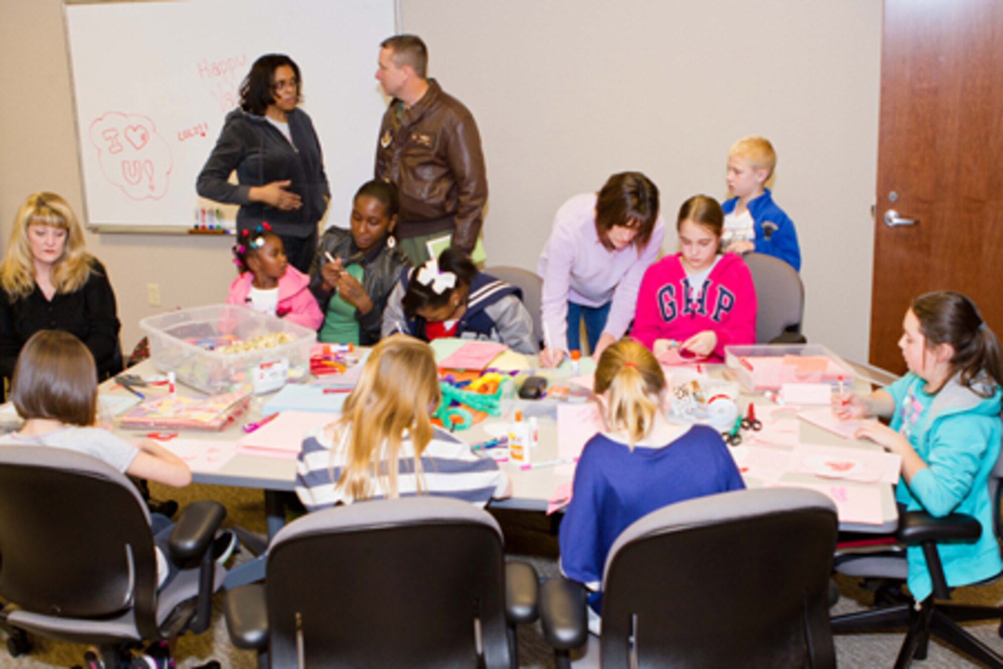 A group of family, friends and co-workers of deployed members of the 917th Fighter Group prepare Valentine’s Day cards and gifts at Barksdale Air Force Base, La., Feb. 11, 2012. They also videotaped short messages that will be emailed to their loved ones on Valentine’s Day. (Courtesy photo by Donna Caughlin)  