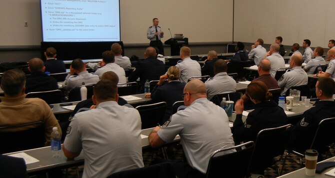 DENVER -- Maj. Daniel Schneider from Wright-Patterson Air Force Base, Ohio, teaches an environmental health reporting class Monday during the 20th annual Environment, Safety and Occupational Health Symposium at the Colorado Convention Center here.  (U.S. Air Force photo by Michael Briggs)