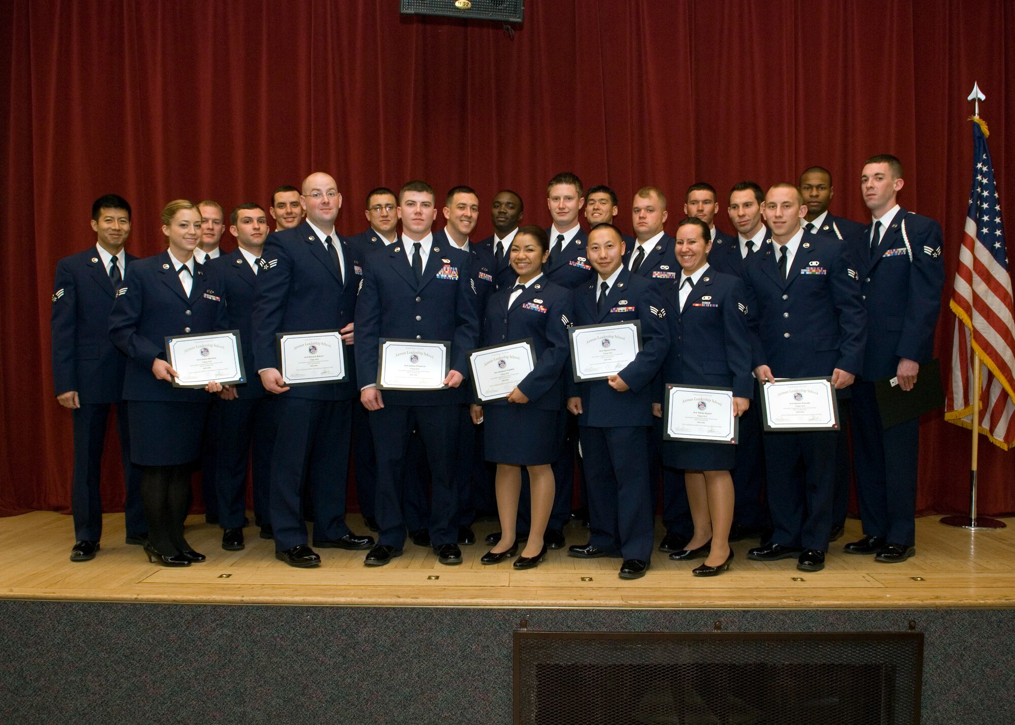 Class 2012-B graduates from Airman Leadership School, Feb. 9, at the Stripes Lounge. Twenty-one graduates have new skills to help them develop as leaders. (U.S. Air Force photo by Edward Cannon)