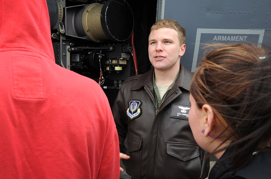 U.S. Air Force 1st Lt. Kyle Carnahan, 16th Special Operations Squadron pilot, explains AC-130H Spectre gunship mechanics to members from the New Mexico Baptist Children?s Home in Portales, N.M., on the flightline at Cannon Air Force Base, N.M., Feb. 11, 2012. Kids from the home were invited by Cannon Air Commandos to enjoy pizza, games, a base tour and bowling at Cannon. (U.S. Air Force photo by Airman 1st Class Alexxis Pons Abascal)  