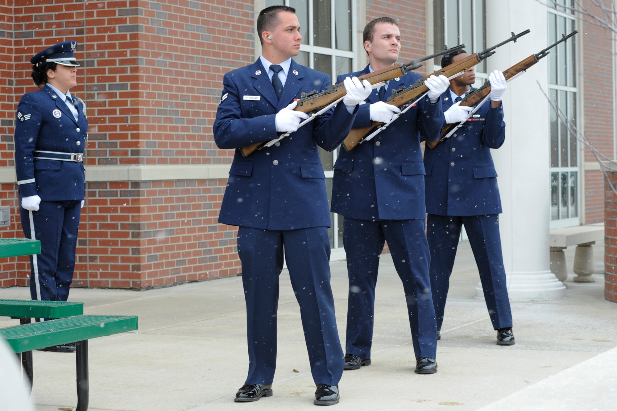 Senior Airman Elizabeth Licari serves as the honor guard commander during a training session of the 127th Wing Honor Guard at Selfridge Air National Guard Base, Mich., Feb. 10, 2012. Preparing to fire a volley are Airman 1st Class Joseph Digiovanni, Airman 1st Class Wesley Retka and Senior Airman Western Chase. (U.S. Air Force photo by John S. Swanson)