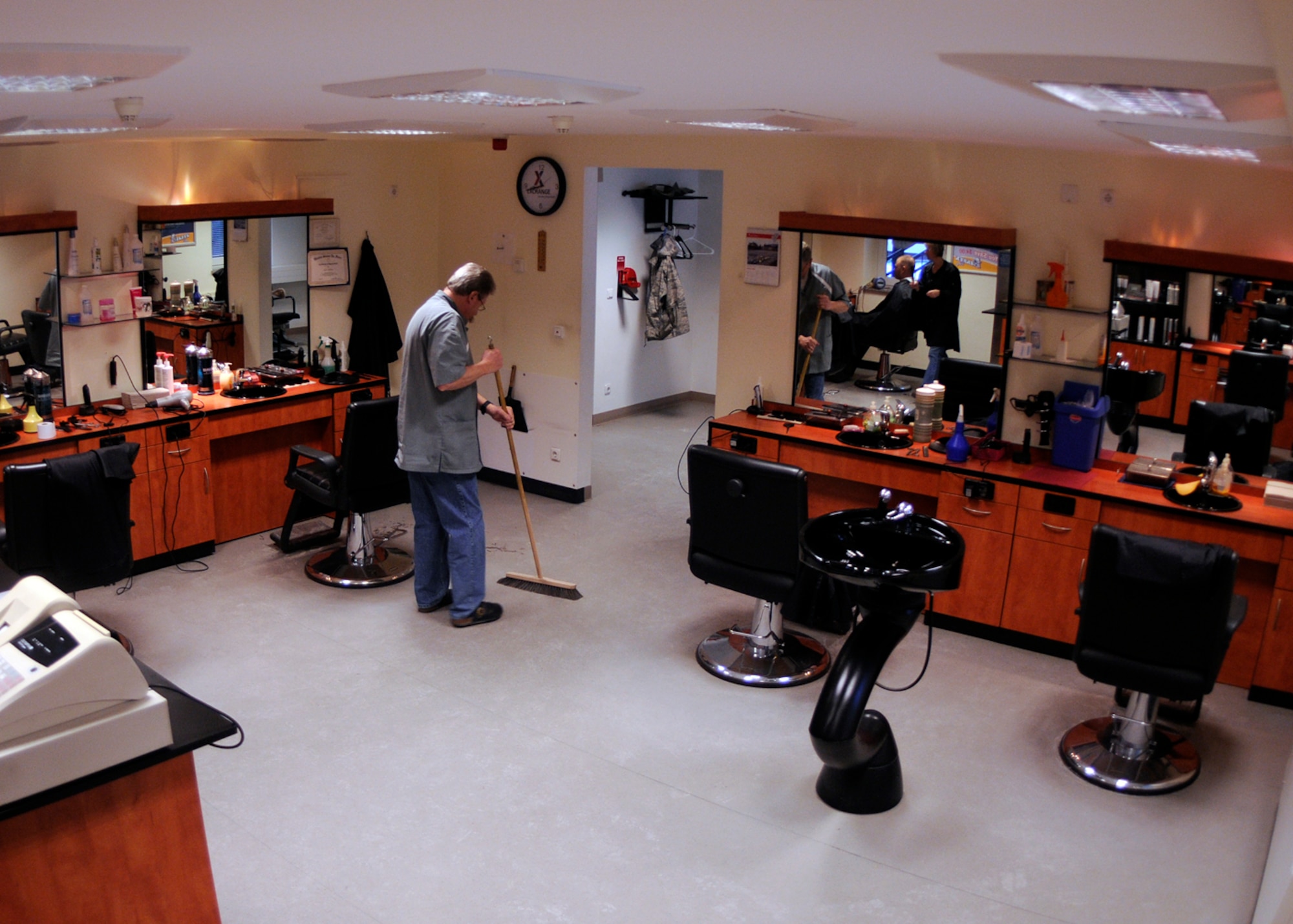 SPANGDAHLEM AIR BASE, Germany – Heinz Willems cleans his area after a haircut at the barbershop here Feb. 10. Willems began work at the Spangdahlem barbershop Jan. 15, 1972, and has cut the hair of thousands of service members and their families during his four decades of service. Willems learned to speak English by talking with his customers. The 52nd Force Support Squadron honored Willems and coworker Guenther Anhuth during a length-of-service ceremony in January. Anhuth has worked here since 1969, marking 83 years of combined haircutting service to the Spangdahlem AB and Bitburg Annex community. (U.S. Air Force photo by Staff Sgt. Daryl Knee/Released)