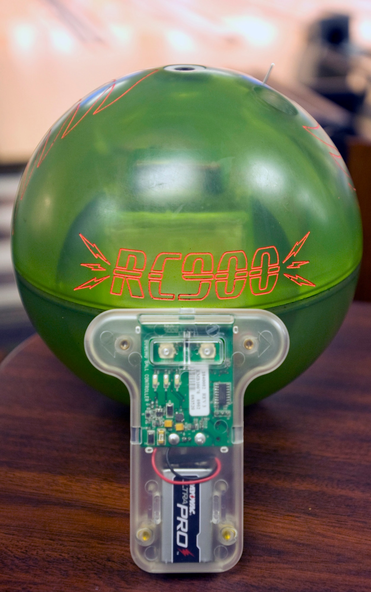 The remote controlled bowling ball and controller were designed to help wounded service members bowl. The ball's remote-control controls the spin of the ball, allowing the user to adjust its position as it travels down the lane. (U.S. Air Force photo by Senior Airman Matthew Hubby)