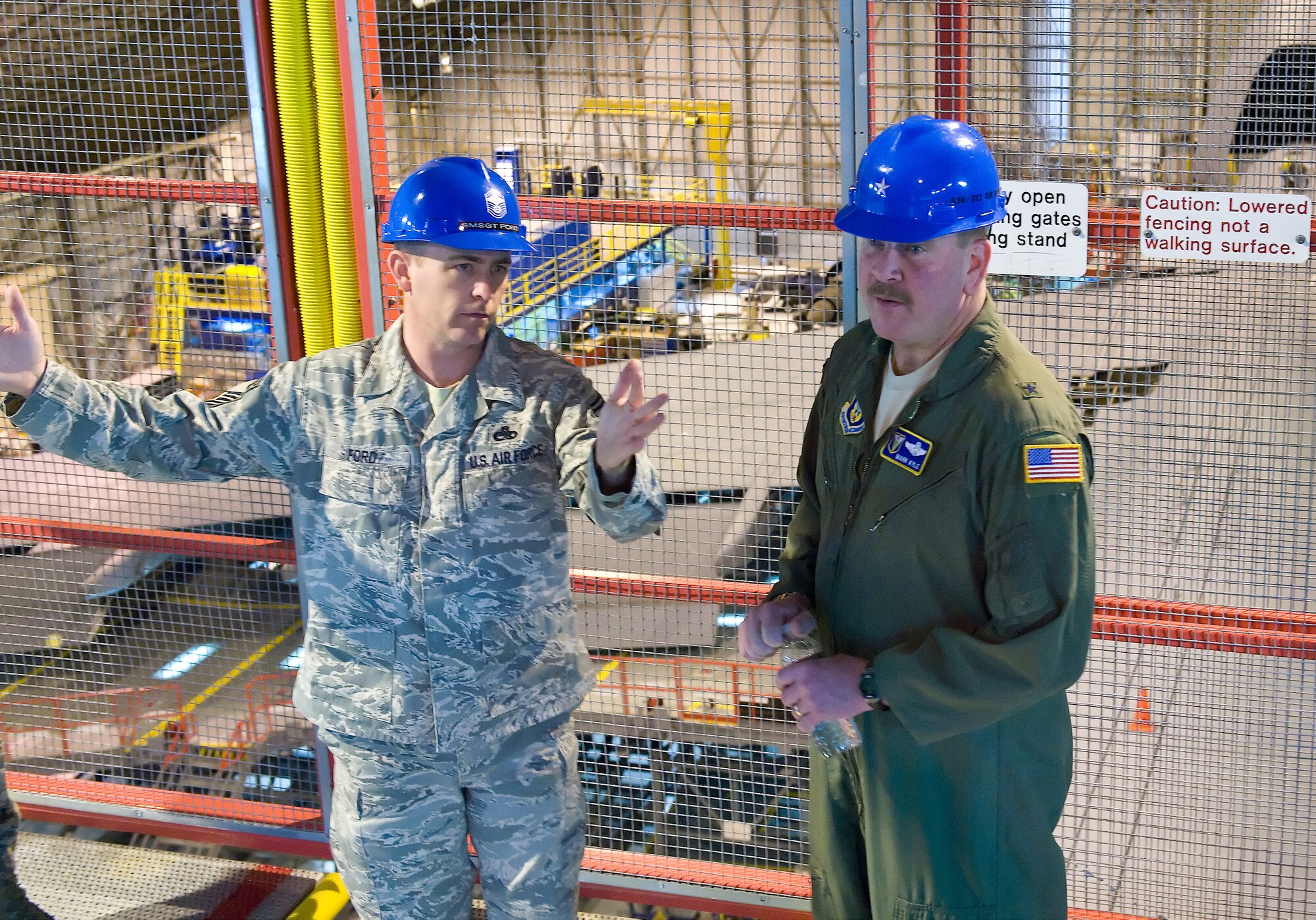 Senior Master Sgt. Bryan Ford, 512th Maintenance Squadron maintenance flight chief, briefs Brig. Gen. Mark A. Kyle, commander of the 4th Air Force, March Air Reserve Base, Calif., on the C-5 isochronal inspection process at Dover Air Force Base, Del. The general visited wing leadership and 512th Airlift Wing reservists and personnel Feb. 9-10, 2012, at Dover AFB. During his visit, the general flew on a C-5M, held a commander?s call at the base theater, and received a briefing by aircraft maintenance supervision in the ISO inspection hangar. (U.S. Air Force photo/Roland Balik)