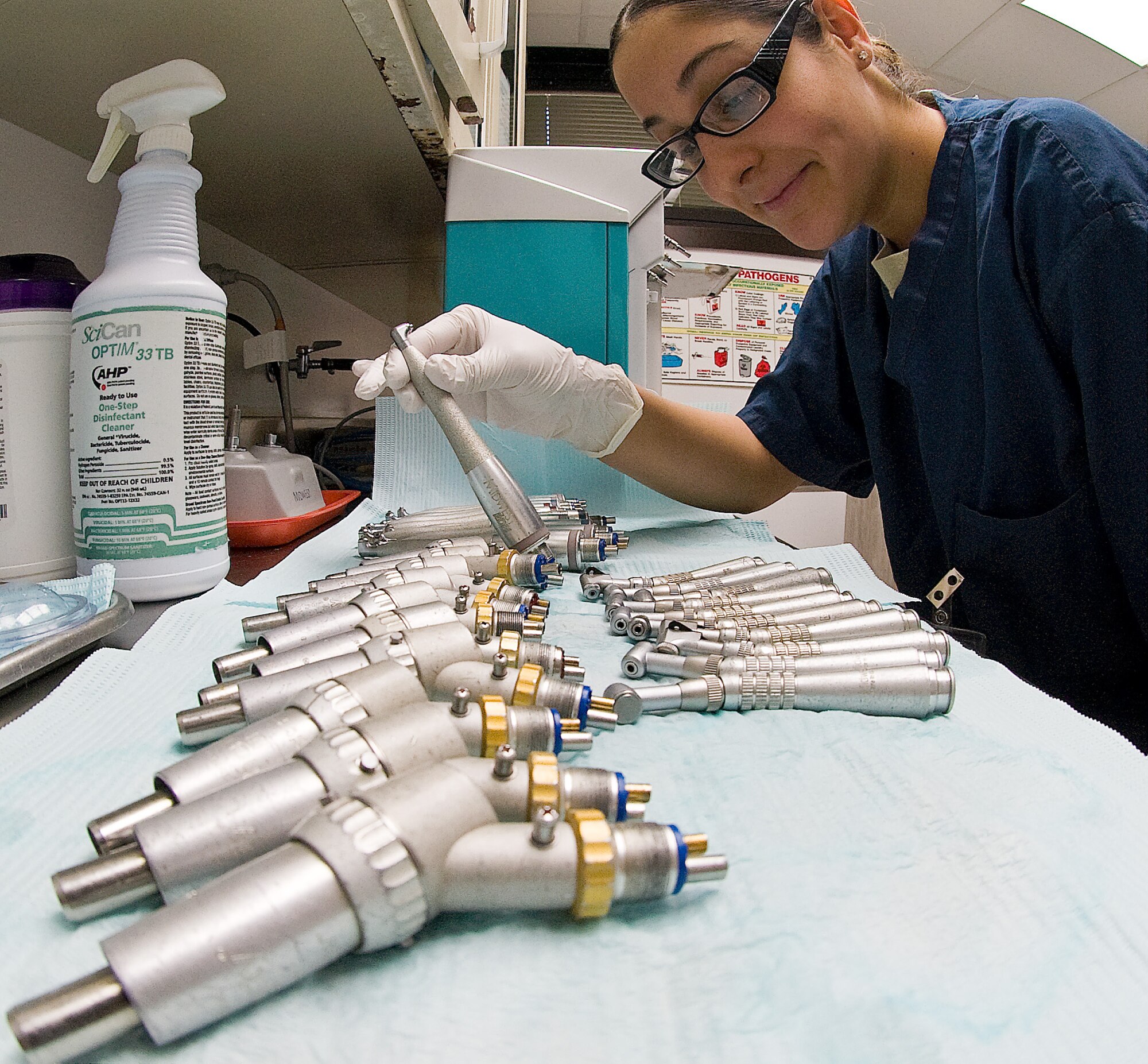 Staff Sgt. Monica Quintana, NCO in charge of infection control with the 436th Dental Squadron, inspects dental hand pieces used clean on teeth Feb. 10, 2012, at Dover Air Force Base, Del. Quintana cleans, sterilizes and lubricates tools used in patient care. (U.S. Air Force photo by Senior Airman Jacob Morgan)