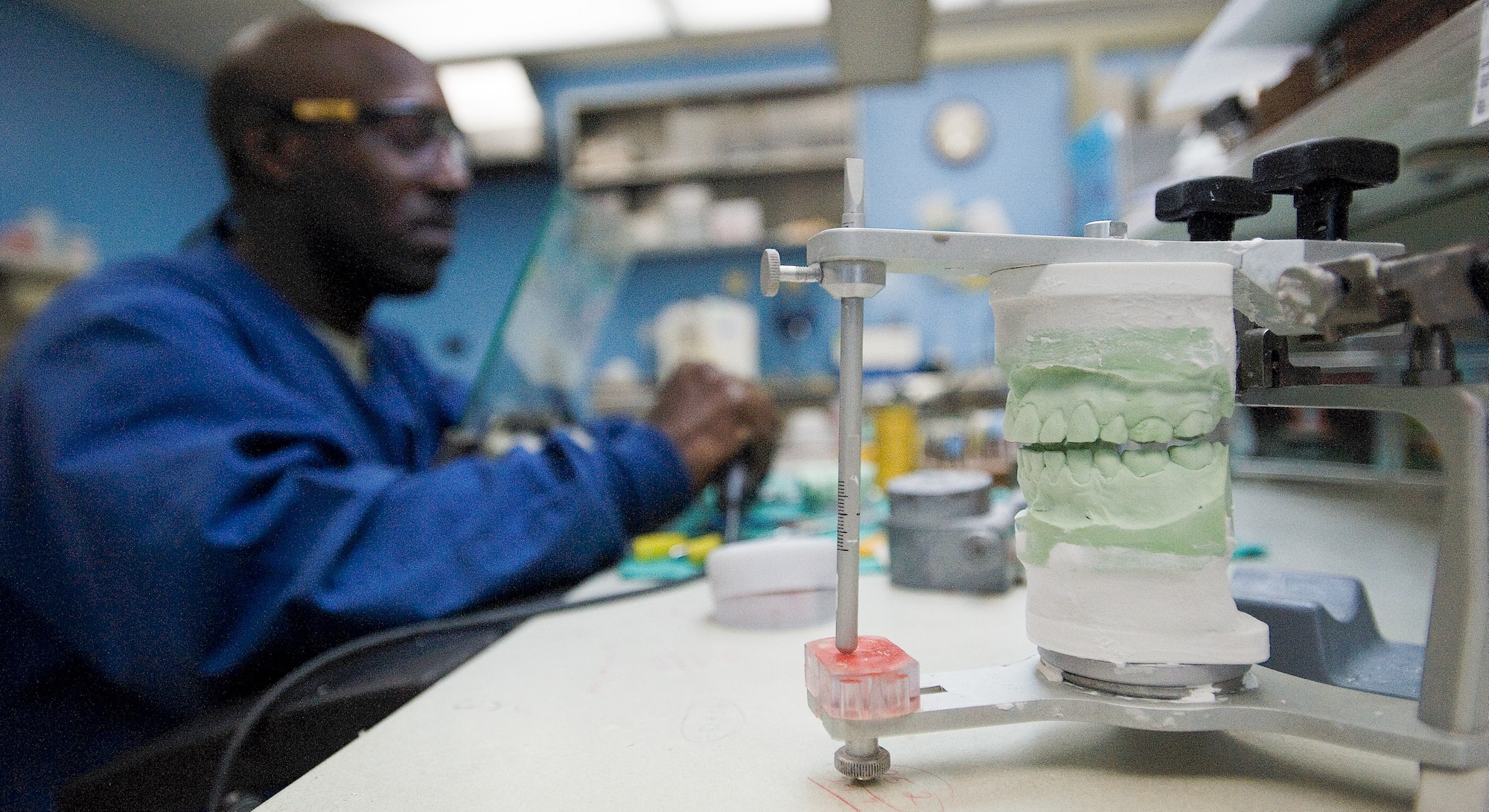 A diagnostic cast sits on the desk of Master Sgt. Eric Devese, NCO in charge of the laboratory flight with the 436th Dental Squadron, Feb. 10, 2012, at Dover Air Force Base, Del. The laboratory flight is responsible for casting molds and building crowns for patients. (U.S. Air Force photo by Senior Airman Jacob Morgan)