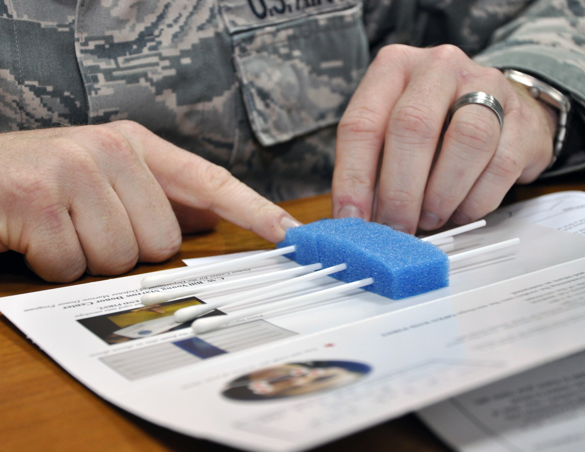 Tech. Sgt. Gregory Frank, 386th Air Expeditionary Wing Manpower Office, secures the last swab of a sample of tissue to send to the C.W. Bill Young Department of Defense Marrow Donor Program, at an undisclosed location, Southwest Asia, Feb. 12, 2012. Frank is leading the way for other 386th AEW Airmen to register for the bone marrow registry, and is coordinating a wing bone marrow drive in the near future. Frank is a native of Nelsonville, Ohio, deployed from the 3rd Manpower Requirements Squadron, Scott Air Force Base, Ill. (U.S. Air Force photo/Tech. Sgt. Stacy Fowler)
