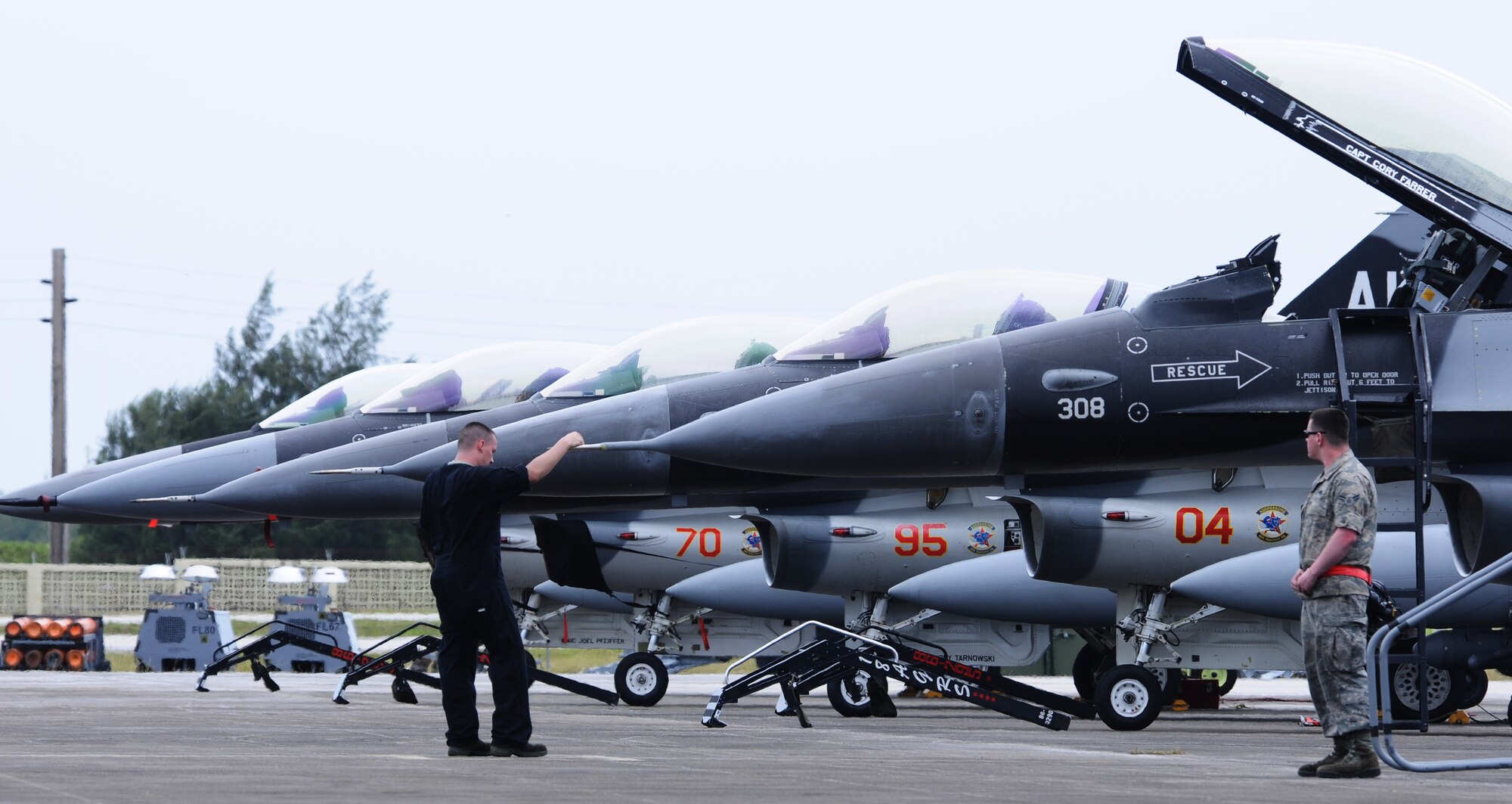 ANDERSEN AIR FORCE BASE, Guam- Maintainers from the 18th Aggressor Squadron, Eielson Air Force Base, Alaska, stand ready to receive the pilots to aboard the F-16 Fighting Falcon Aggressor, Feb. 14. The 18 AS is here in support of Cope North 2012, flying as the opposing force to the other aircraft participating in the Exercise. (U.S. Air Force photo/Senior Airman Carlin Leslie)
