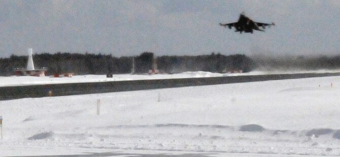 The first F-16 Fighting Falcon destined for exercise Cope North lifts off the runway at Misawa Air Base, Japan, Feb. 10, 2012. More than 10 F-16s from Misawa will participate in an exercise scheduled to last more than two weeks at Anderson Air Force Base, Guam. (U.S. Air Force Photo by Tech. Sgt. Phillip Butterfield/Released)