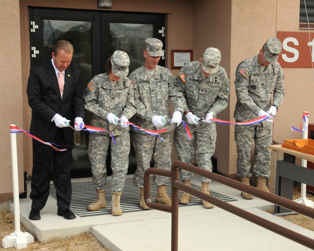 Representatives from U.S. Army Garrison Daegu and the 19th Expeditionary Sustainment Command cut the ribbon on a new administration building at the Busan Storage Center Dec. 7.