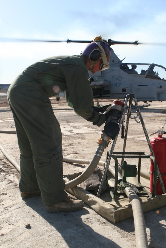 MARINE CORPS AIR STATION YUMA, Ariz. – Pfc. Bradley Hinsley, a bulk-fuel specialist with Marine Wing Support Squadron 373 and a Bakersfield, Calif., native, secures the fuel hose after refueling an AH-1W Super Cobra aboard Marine Corps Air Station Yuma, Ariz., Feb. 14. MWSS-373 set up a FARP in support of Scorpion Fire Phase II. Scorpion Fire is a two-week training evolution to provide support for pilots’ pre-deployment training.
