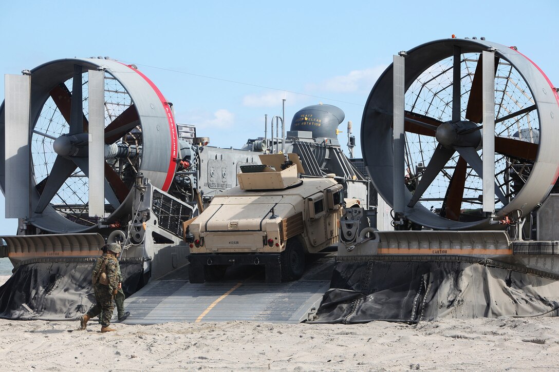 MARINE CORPS BASE CAMP LEJEUNE, N.C. – Marines and sailors with the 22nd Marine Expeditionary Unit practice properly loading and securing tactical vehicles aboard a Landing Craft Air Cushion during a training exercise, March 11, 2011, at Onslow Beach, Marine Corps Base Camp Lejeune, N.C.  The Marines and sailors of the 22nd MEU are currently deployed with Amphibious Squadron 6 aboard USS Bataan Amphibious Ready Group and will continue to conduct a series of progressively complex exercises designed to train and test the MEU’s ability to operate as a cohesive and effective Marine Air Ground Task Force.  (Official Marine Corps photo by Sgt. Josh Cox/released)