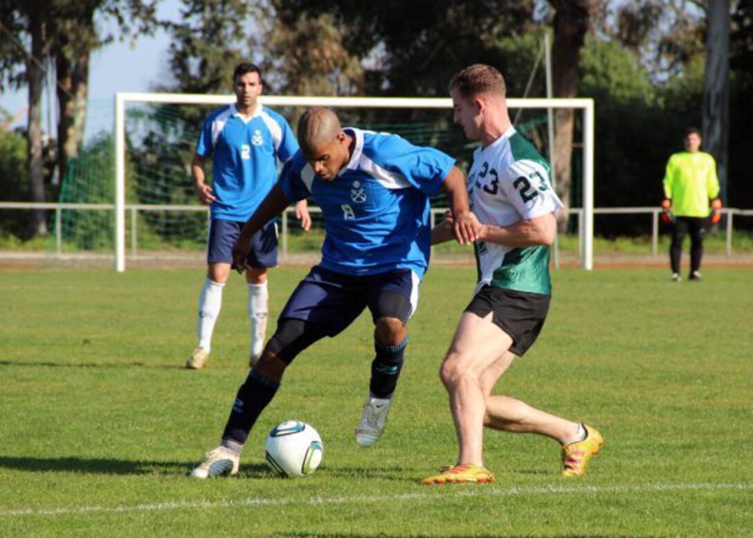 The USS Bataan soccer team, comprised of Marines and sailors with the 22nd Marine Expeditionary Unit and USS Bataan, play soccer against a Portuguese team during a port visit, Jan. 24, 2012. The Marines and sailors of the 22nd MEU are currently deployed with Amphibious Squadron 6 aboard the USS Bataan Amphibious Ready Group.