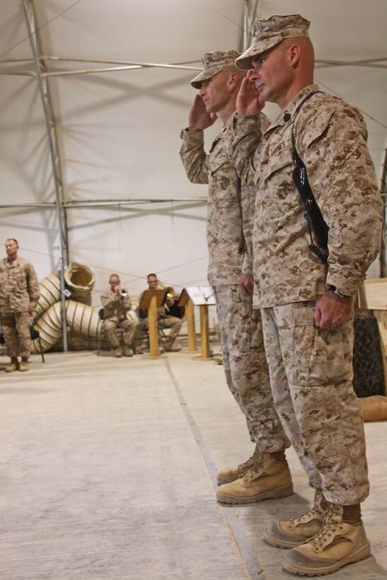 Col. Michael Sweeney (back), the commanding officer of Task Force Belleau Wood, and Sgt. Maj. Craig Cressman, the sergeant major of TFBW, salute during the National Anthem at the 236th Marine Corps birthday ceremony aboard Camp Leatherneck, Helmand province, November 10.  It is tradition that Marines across the world, regardless of operational tempo, take time out of their day on the Marine Corps birthday to honor their beloved Corps history and legacy.