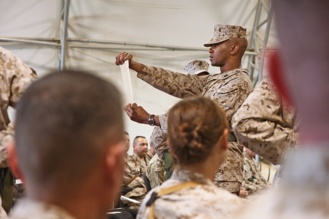 Capt. Romell Short, a logistics officer with 1st Battalion, 25th Marine Regiment, reads Lt. Gen. John A. Lejeune’s birthday message off a scroll of paper at the 236th Marine Corps birthday ceremony aboard Camp Leatherneck, Helmand province, November 10. It is tradition that Marines across the world, regardless of operational tempo, take time out of their day on the Marine Corps birthday to honor their beloved Corps history and legacy.