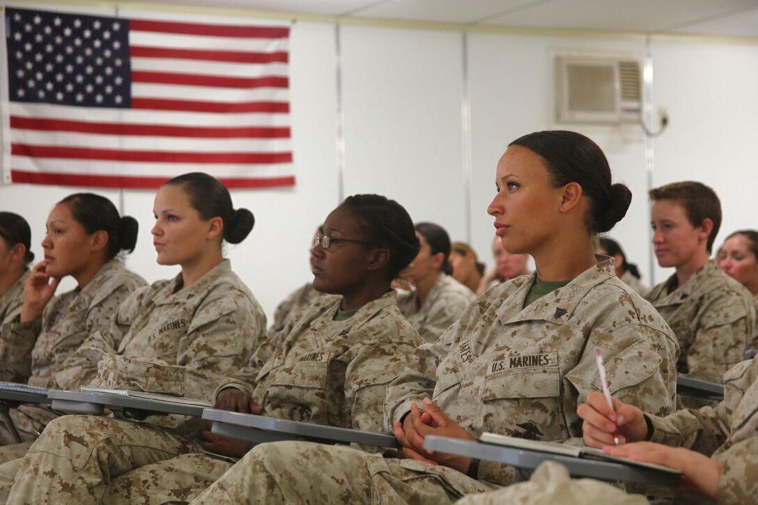 Cpl. Brandy Bates, assigned to Female Engagement Team 11 in Marjah district, Helmand province, and a native of Ann Arbor, Mich., listens to other Marines with FET talk about their experiences so far on the deployment. The Marines assigned to the team travel to Camp Leatherneck every 45 days for reset training, before going back to the battalions they are assigned to.