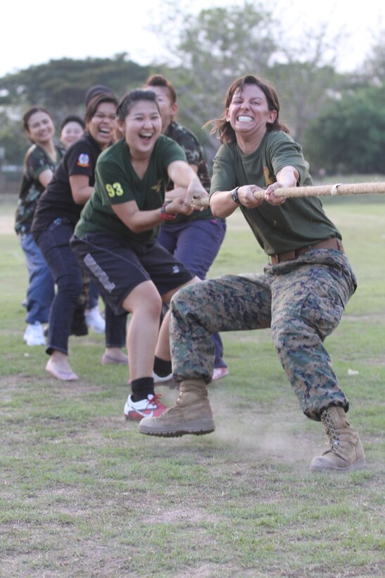 2nd Lt. Jocelyn M. Mills (front) and Royal Thai Armed Forces 2nd Lt. Arada Youdlad work together during a tug-of-war match here, Feb. 5. Service members from the Combined Joint Civil Military Operations Task Force gathered to improve interoperability through sporting activities during Exercise Cobra Gold 2012. Exercise Cobra Gold is an annual Thai and U.S. co-sponsored joint and multinational exercise designed to advance security throughout the Asia-Pacific region and enhance interoperability with participating nations.