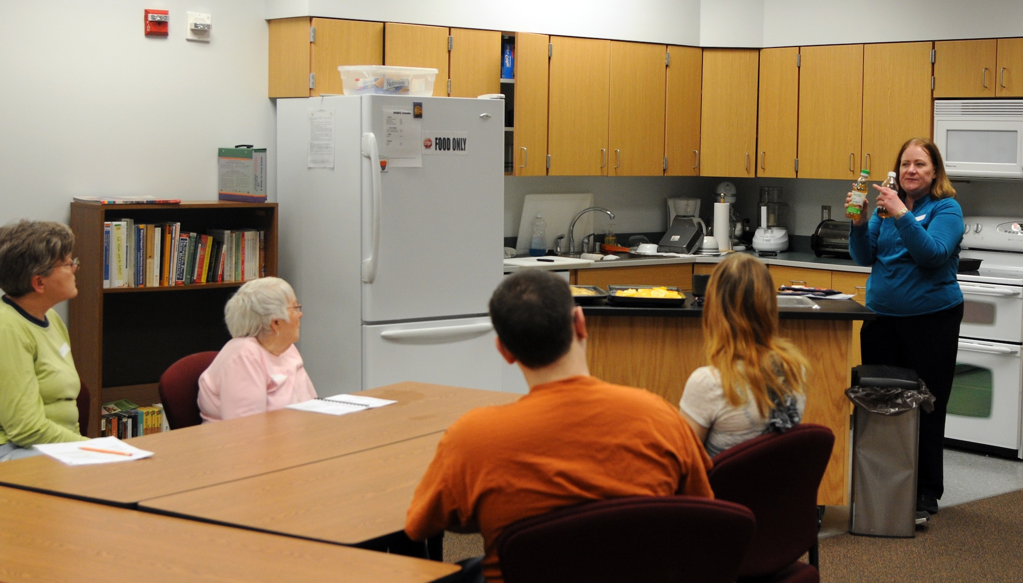 Susan Runyan, Health and Wellness Center dietician, explains the difference between two types of vinegar during Find the Chef in You at the HAWC, Feb. 13, 2012, Eielson Air Force Base, Alaska. With the help of the instructor, students prepared foods that support a healthy lifestyle. (U.S. Air Force photo/ Senior Airman Janine Thibault)
