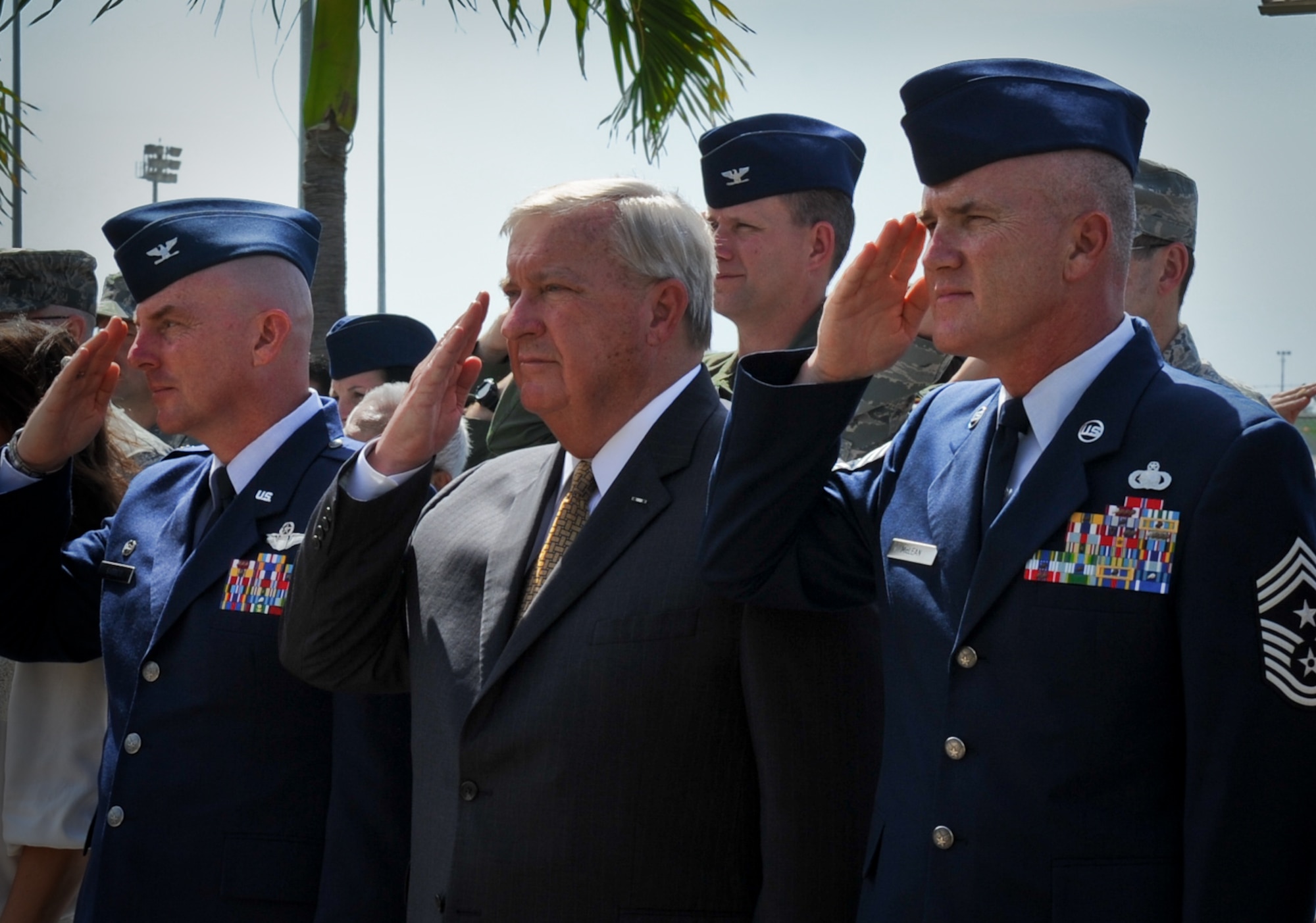 Col. Sam Barrett, 15th Wing commander, 9th Chief Master Sgt. of the Air Force James Binnicker, and Chief Master Sgt. Brooke McLean, Pacific Air Forces command chief, render a salute as the National Anthem plays at the newly renamed Binnicker Professional Military Education Center on Joint Base Pearl Harbor-Hickam, Hawaii Feb. 15. Binnicker entered the Air Force in 1957 and retired 33 years later after serving as Chief Master Sgt. of the Air Force for four years. (U.S. Air Force photo/Senior Airman Lauren Main)