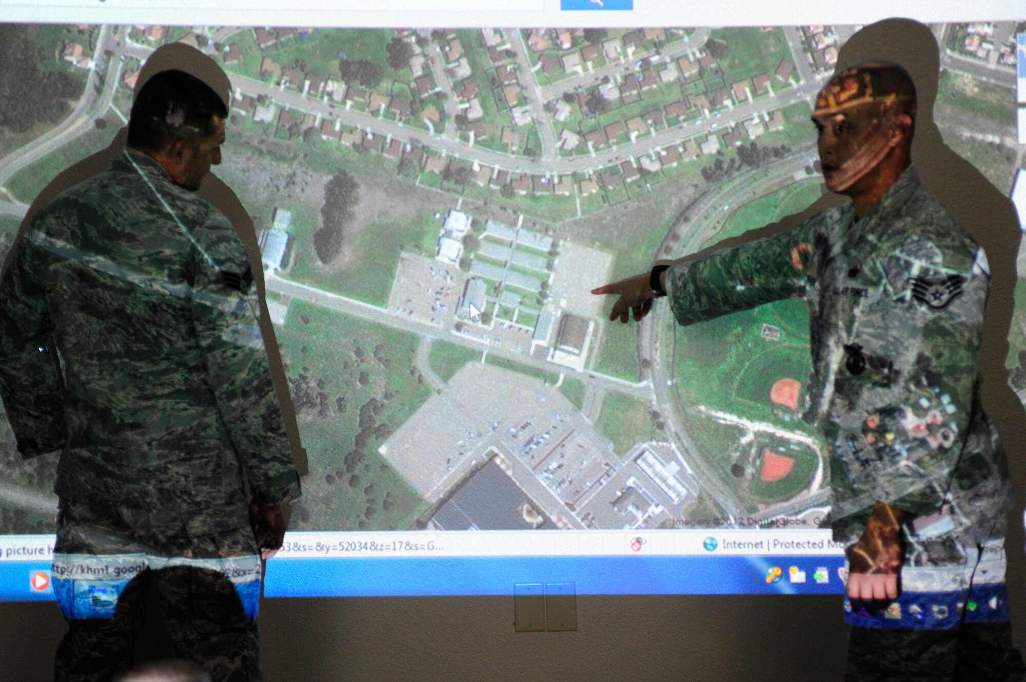 VANDENBERG AIR FORCE BASE, Calif. --Staff Sgt. Nathan Kraven, 30th Security Forces Squadron trainer, shows simulated entry control objectives during an active shooter training course here Thursday, Feb. 2, 2012. The courses the trainers teach allow the trainees to understand why their operations are performed and how they can be executed without any issues. (U.S. Air Force photo/Staff Sgt. Andrew Satran) 

 