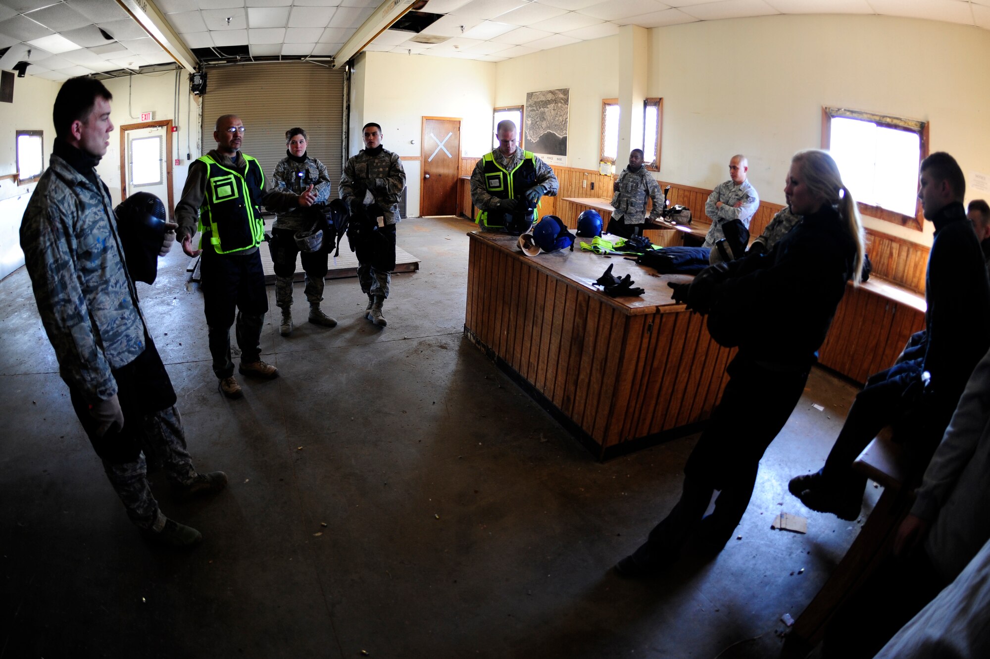 VANDENBERG AIR FORCE BASE, Calif. -- Chirstopher Baltazar, 30th Security Forces Squadron trainer, debriefs the 30th SFS trainees during an active shooter training course here Thursday, Feb. 2, 2012. The 30th SFS trainers teach tactics, share their deployed experiences and knowledge to show a spectrum of incidents that can occur and how to operate effectively in any environment. (U.S. Air Force photo/Staff Sgt. Andrew Satran) 

 