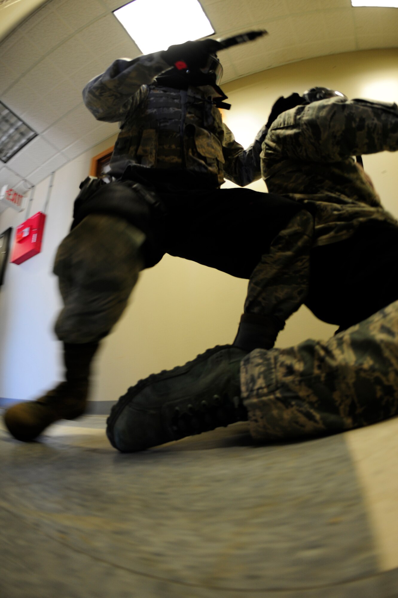VANDENBERG AIR FORCE BASE, Calif. --A 30th Security Forces Squadron member apprehends a subject during an active shooter training course here Thursday, Feb. 2, 2012. The 30th SFS trainers safely demonstrate how to properly detain individuals while maintaining a safe environment. (U.S. Air Force photo/Staff Sgt. Andrew Satran) 

 