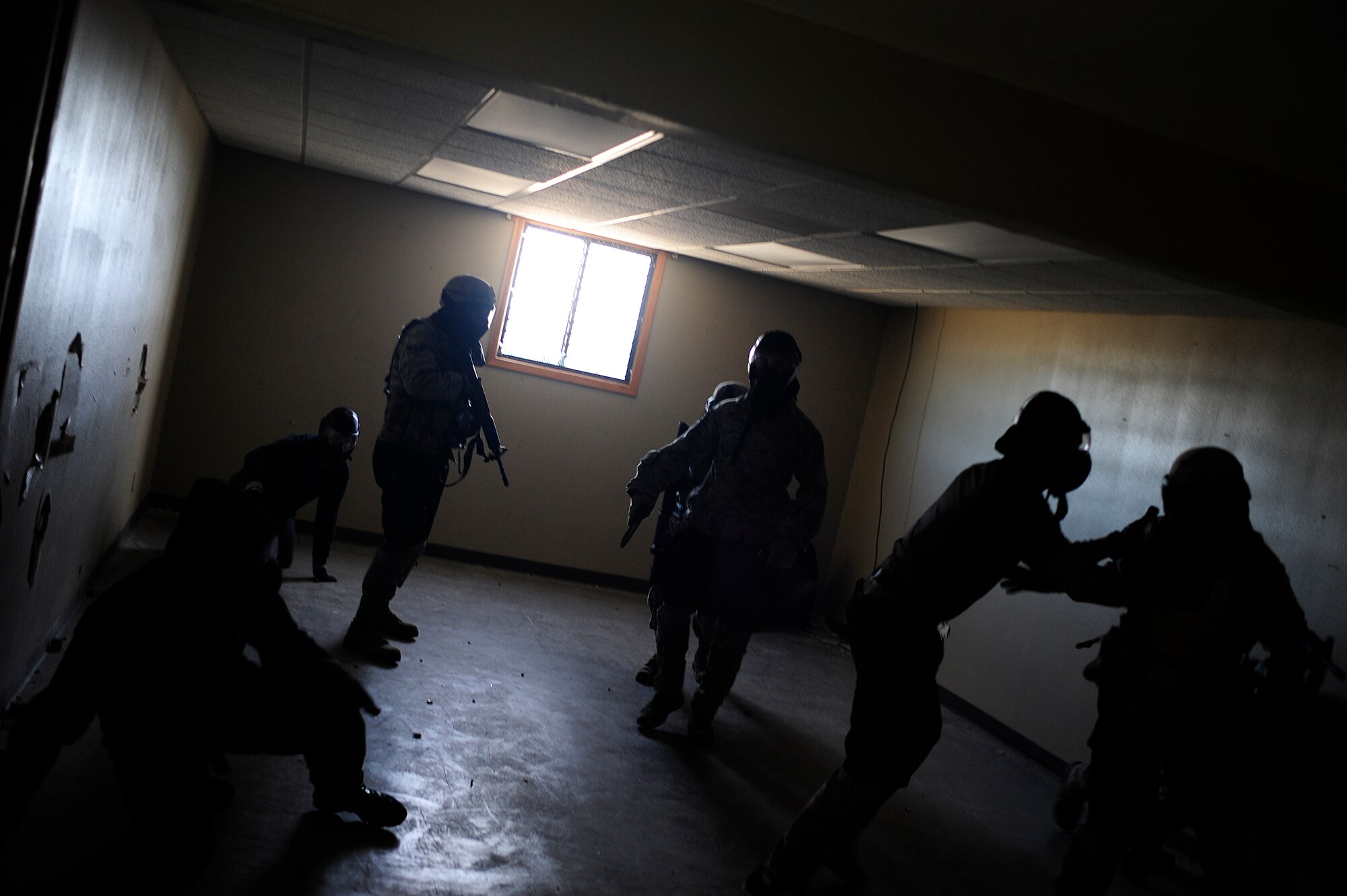 VANDENBERG AIR FORCE BASE, Calif. --Members of the 30th Security Forces Squadron practice proper restraining techniques during an active shooter training course here Thursday, Feb. 2, 2012. The 30th SFS trainers give hands-on training allowing the members to make the exercise realistic in nature. (U.S. Air Force photo/Staff Sgt. Andrew Satran) 

 