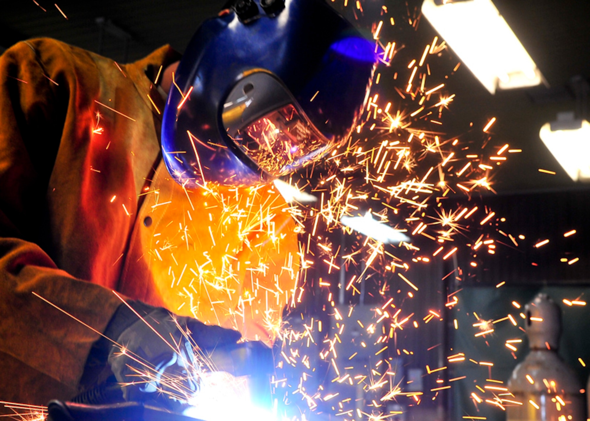 Senior Airman James Turner, 51st Maintenance Group aircraft metal technology journeyman, uses a plasma cutter to cut a piece of excess metal   Feb. 12, 2012. The Plasma Cutter works by sending pressurized gas through a small channel which contains negatively charged electrodes. Once power is applied and the tip of the nozzle is applied to metal the connection creates a circuit. As the inert gas passes through the channel the spark heats the gas until it reaches the fourth state of matter in which the reaction creates a stream of directed plasma, approximately 30,000 degrees. (U.S. Air Force photo/Senior Airman Adam Grant)