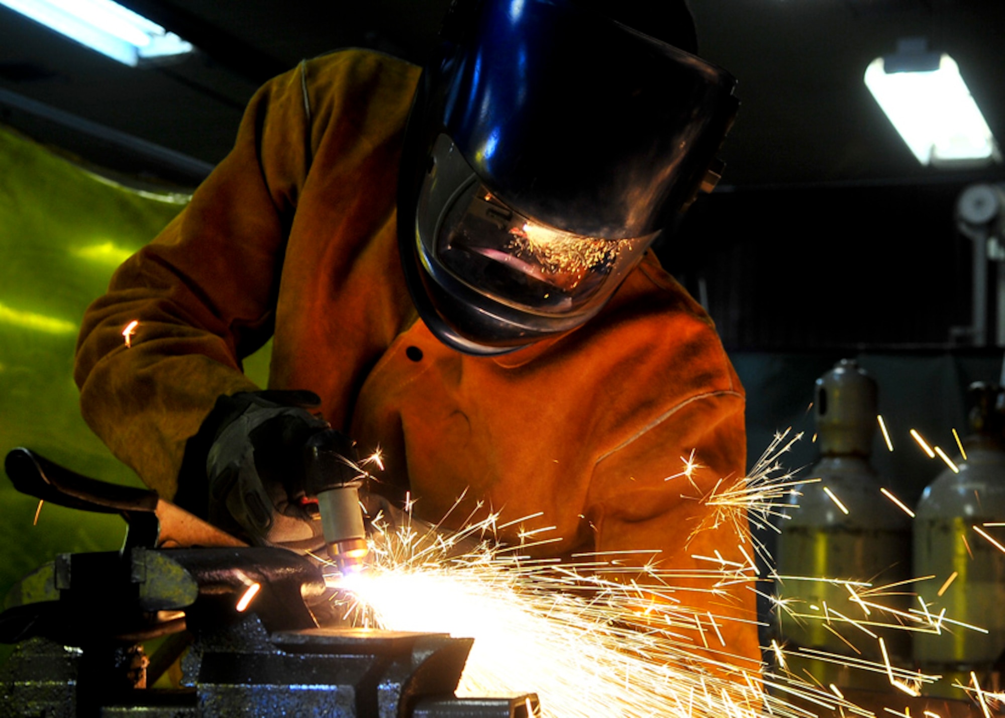 Senior Airman James Turner, 51st Maintenance Group aircraft metal technology journeyman, uses a plasma cutter to cut thick pieces of metal Feb. 12, 2012. The Plasma cutter is used to cut pieces of metal that are thick that a saw is unable to penetrate. (U.S. Air Force photo/Senior Airman Adam Grant) 