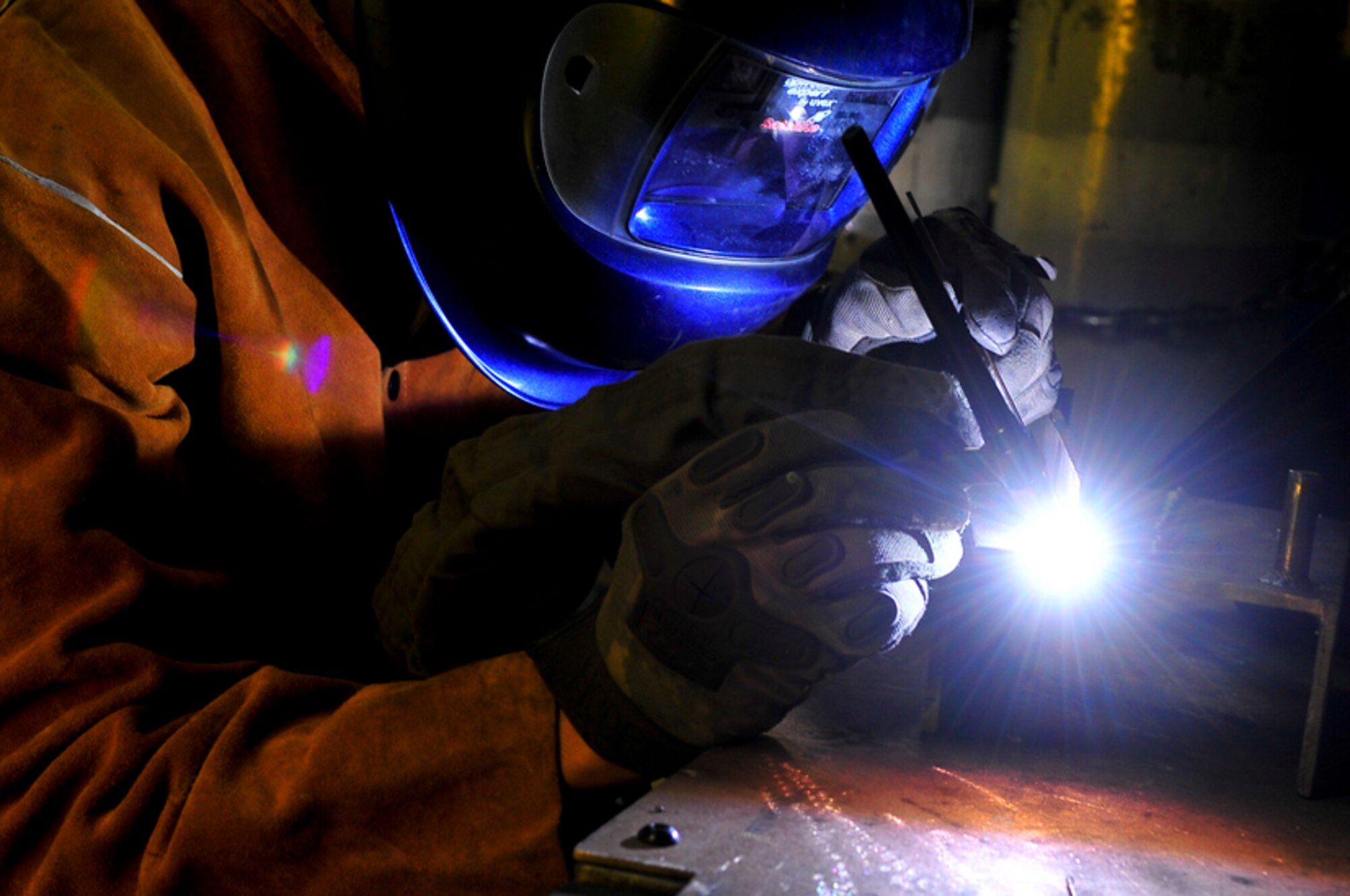 Senior Airman James Turner, 51st Maintenance Group aircraft metal technology journeyman, welds a piece of metal Feb. 12, 2012. Airman Turner is able to weld the small parts of aircraft together with tungsten which is used for smaller metals and is easier to control. (U.S. Air Force photo/Senior Airman Adam Grant) 