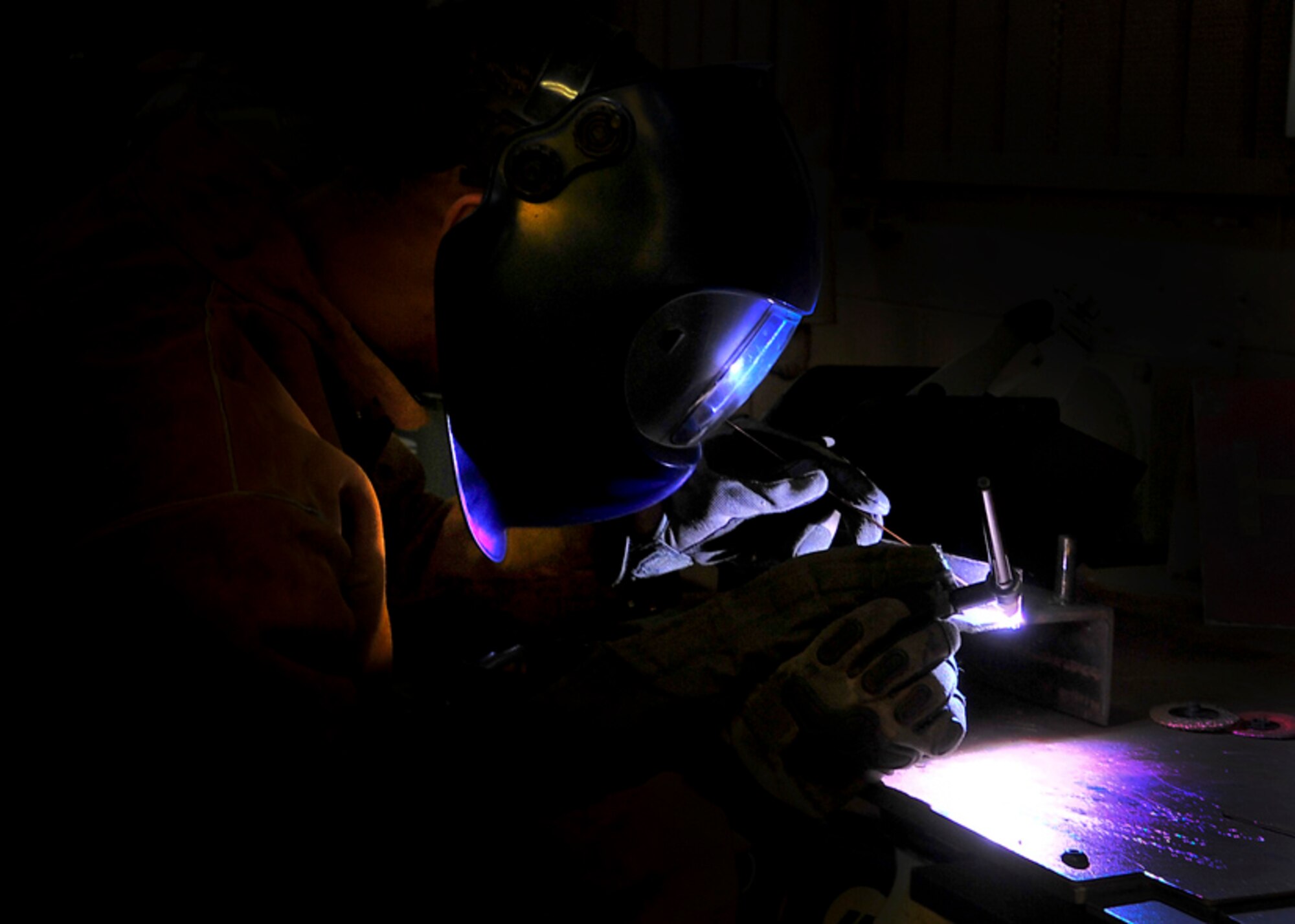 Senior Airman James Turner, 51st Maintenance Group aircraft metal technology journeyman, welds a piece of metal Feb. 12, 2012. Airman Turner is welding parts together that have broken off using a form welding known as Tungsten welding.  (U.S. Air Force photo/Senior Airman Adam Grant)