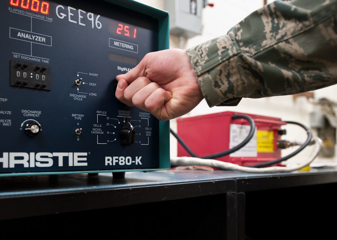 Airman 1st Class Bryan Dock, 28th Maintenance Squadron electro-environmental systems technician, adjusts the metering on a Christie battery charger while charging a B-1B battery at Ellsworth Air Force Base, S.D., Feb. 9, 2012. The battery is specific to the B-1B, and must be drained and recharged after each flight to ensure it is ready for aircraft operations. (U.S. Air Force photo by Airman Alystria Maurer/Released)