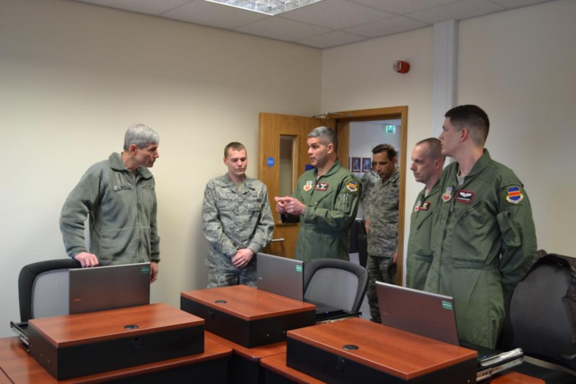 U.S. Air Force Lt. Col. Alex R. Ganster explains to U.S. Air Force Chief of Staff Gen. Norton A. Schwartz the need for persistent language study and instruction of U.S. Air Force cryptologic linguists at the 488th Intelligence Squadron's Language and Culture Learning Center at Royal Air Force Mildenhall, Feb. 12. Pictured is one of three classrooms in the center prepared to host an instructor from the Defense Language Institute and up to six students for regularly occurring month-long courses of instruction. 

(U.S. Air Force photo by Master Sgt. Richard D. Brillhart/Released)