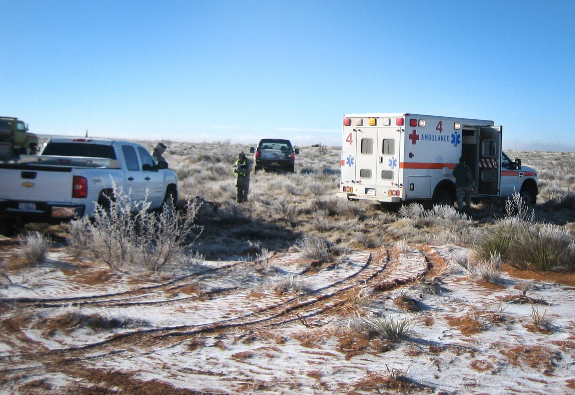 Cannon Emergency Medical Technicians respond to a simulated aircraft crash during a 27th Special Operations Wing exercise at Melrose Air Force Range, N.M., Feb. 13, 2012. During the exercise base personnel were evaluated on actions taken in response to two separate incidents and performed well according to post exercise reports. (U.S. Air Force photo by Maj. Mike Janssen) 