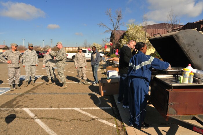 Hungry patrons flock to the savory smell of grilled steak for the Valentine's Day 'Hearty Meal' luncheon on Feb 14, 2012 at Beale Air Force Base, Calif. Customers wait patiently in line while volunteers from various squadrons prepare the meal. (U.S. Air Force Photo by Airman 1st Class Rachael Kane/Released)