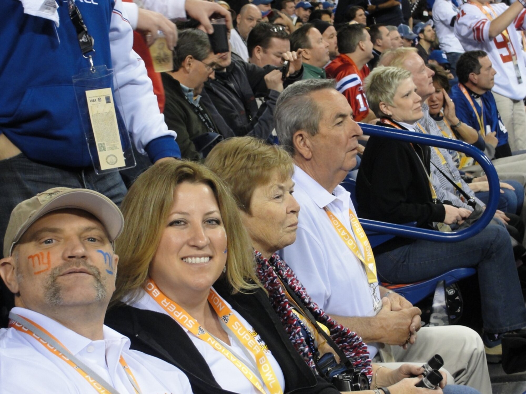 Retired Maj. Kerry Adams and his wife Heather of Beale Air Force Base, Calif., pose for a photo from the stands of Lucas Oil Stadium during Super Bowl XLVI Feb. 5 in Indianapolis. Adams was one of four Air Force club members who participated in the annual Football Frenzy promotion and won a four-day trip to the sporting event. (Courtesy photo)