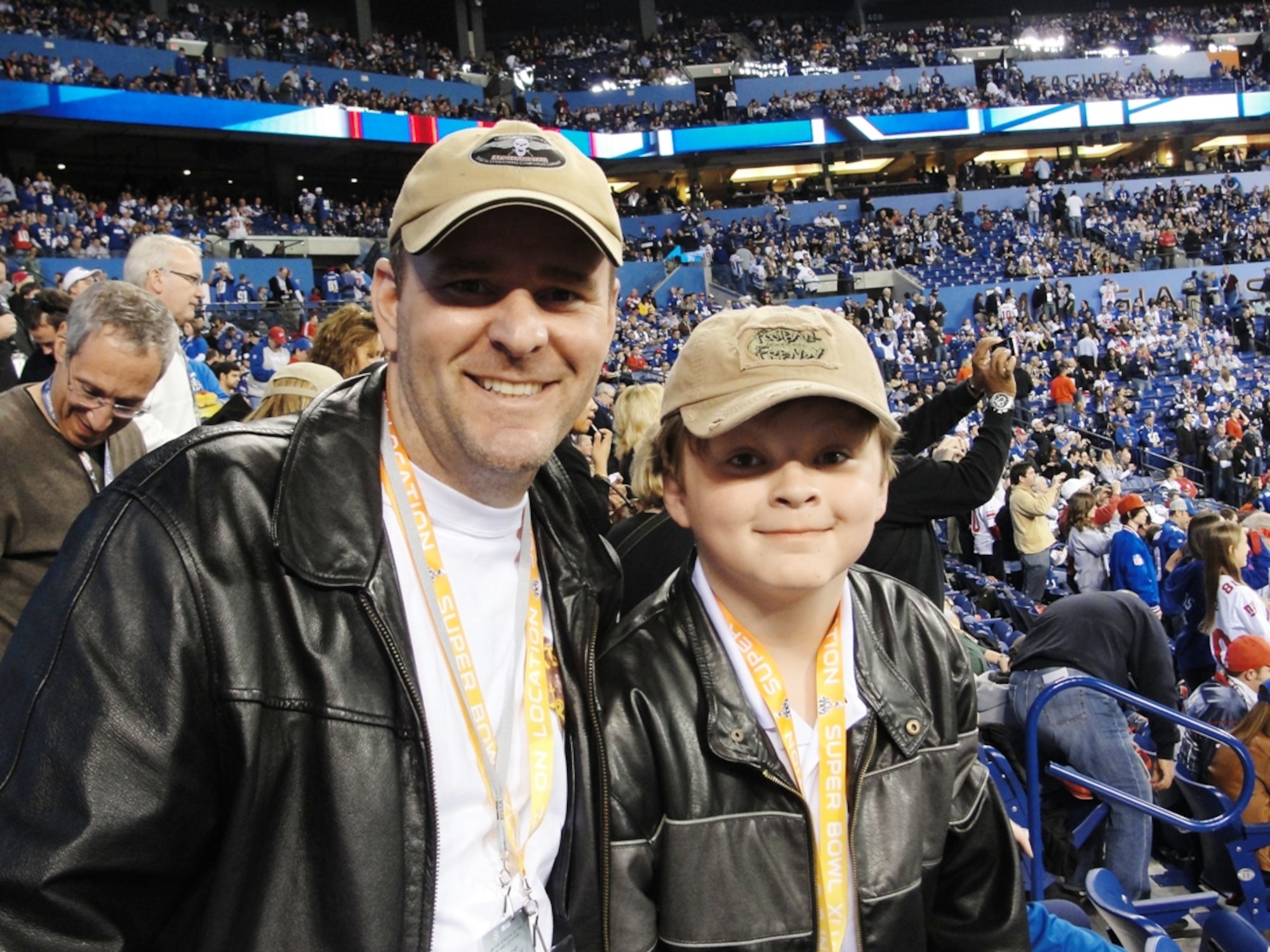 Lt. Col. Brian Hoyback and his son A.J. of Wright Patterson Air Force Base, Ohio, pose for a photo from the stands of Lucas Oil Stadium during Super Bowl XLVI Feb. 5 in Indianapolis. Hoyback was one of four Air Force club members who participated in the annual Football Frenzy promotion and won a four-day trip to the sporting event. (Courtesy photo)