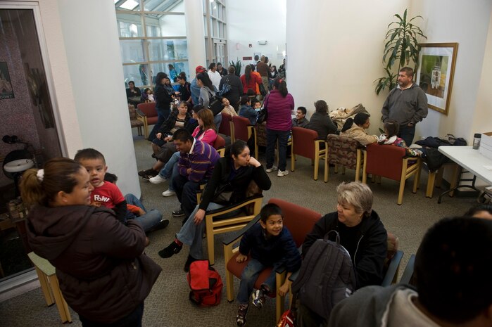 Las Vegas residents wait with families to receive dental work Feb. 11th, 2012 during Give Kids A Smile at the University of Nevada Las Vegas School of Dentistry. Give Kids A Smile is a national event where dental organizations, including the 99th Dental Squadron, screen and provide education to children in need of dental services. The 99th DS, Nellis Air Force Base, Nev., gives back to the community by participating in the event annually, and screened approximately 200 children this year. (U.S. Air Force photo by Senior Airman Brett Clashman)