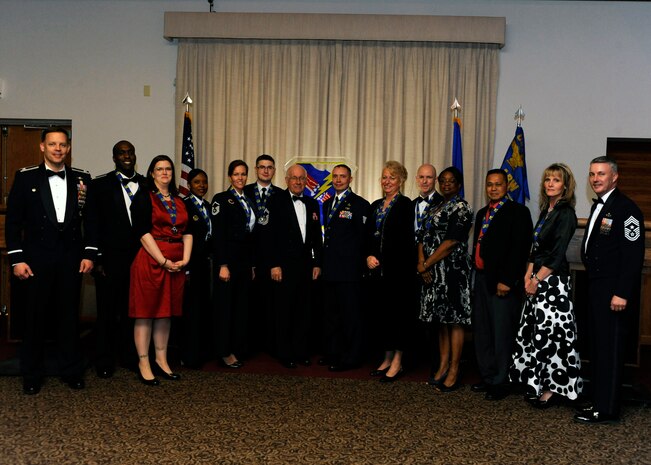 The 99th Air Base Wing annual award winners pose for a group photo during an awards banquet Feb. 10th, 2012 at the Nellis Club, Nellis Air Force Base, Nev. The awards recognize Airmen and civilians for exceptional performance in the workplace and outstanding contributions to the local community over the past year. (U.S. Air Force photo by Airman 1st Class Matthew Lancaster)